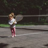 a little girl on the court